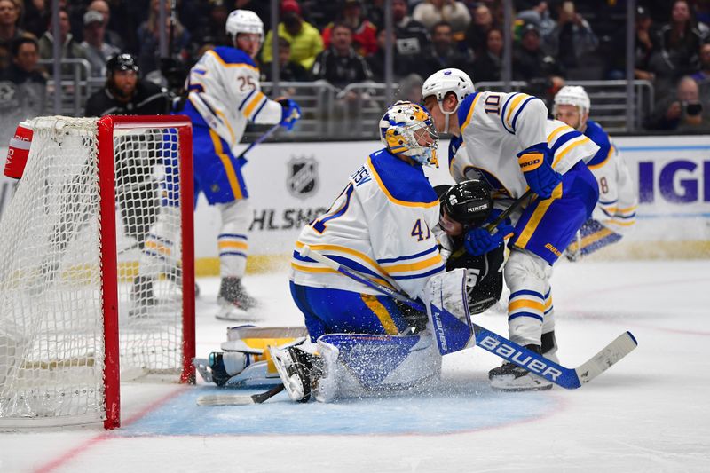 Feb 13, 2023; Los Angeles, California, USA; Buffalo Sabres defenseman Henri Jokiharju (10) and center Blake Lizotte (46) collide with goaltender Craig Anderson (41) during the second period at Crypto.com Arena. Mandatory Credit: Gary A. Vasquez-USA TODAY Sports