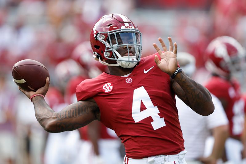 Sep 23, 2023; Tuscaloosa, Alabama, USA;  Alabama Crimson Tide quarterback Jalen Milroe (4) warms up before a game against the Mississippi Rebels at Bryant-Denny Stadium. Mandatory Credit: Butch Dill-USA TODAY Sports