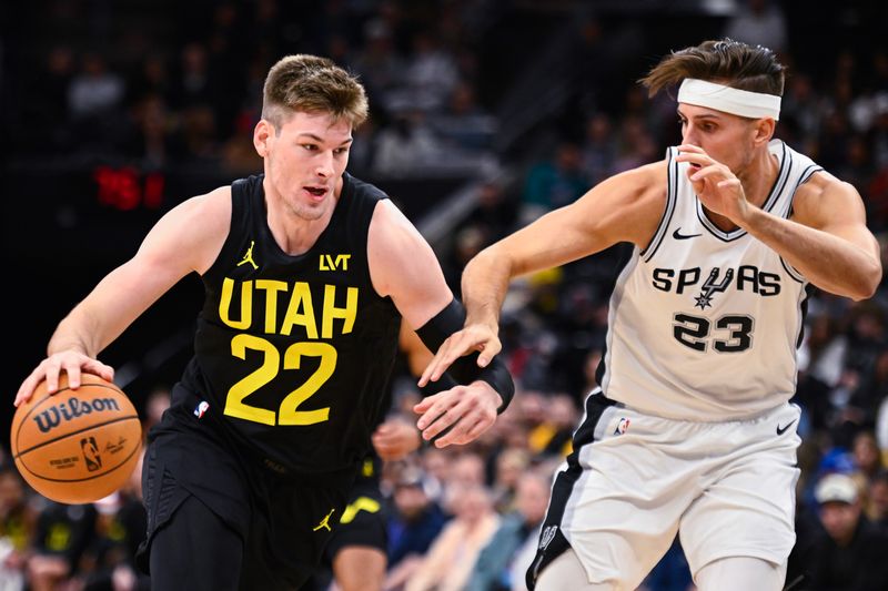 SALT LAKE CITY, UTAH - OCTOBER 31: Kyle Filipowski #22 of the Utah Jazz drives into Zach Collins #23 of the San Antonio Spurs during the first half of a game at Delta Center on October 31, 2024 in Salt Lake City, Utah. NOTE TO USER: User expressly acknowledges and agrees that, by downloading and or using this photograph, User is consenting to the terms and conditions of the Getty Images License Agreement. (Photo by Alex Goodlett/Getty Images)