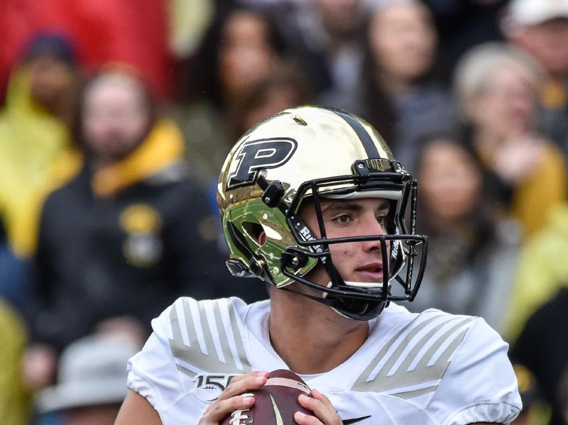 Oct 19, 2019; Iowa City, IA, USA; Purdue Boilermakers quarterback Jack Plummer (13) drops back to throw a pass against the Iowa Hawkeyes during the first quarter at Kinnick Stadium. Mandatory Credit: Jeffrey Becker-USA TODAY Sports