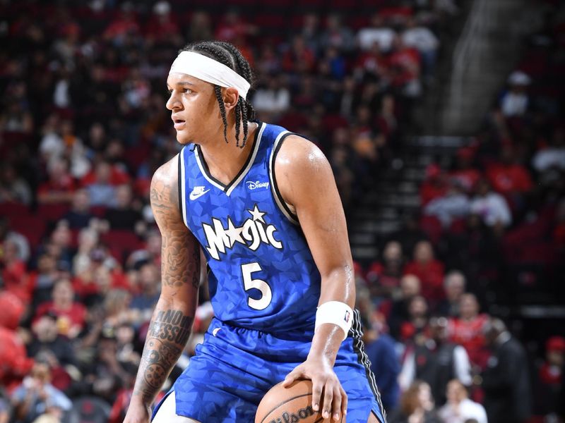 HOUSTON, TX - APRIL 9: Paolo Banchero #5 of the Orlando Magic handles the ball during the game against the Houston Rockets on April 9, 2024 at the Toyota Center in Houston, Texas. NOTE TO USER: User expressly acknowledges and agrees that, by downloading and or using this photograph, User is consenting to the terms and conditions of the Getty Images License Agreement. Mandatory Copyright Notice: Copyright 2024 NBAE (Photo by Logan Riely/NBAE via Getty Images)