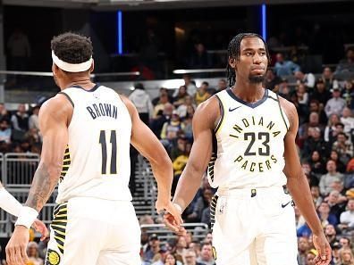 INDIANAPOLIS, IN - DECEMBER 18: Bruce Brown #11  high fives  Aaron Nesmith #23 of the Indiana Pacers during the game against the LA Clippers on December 18, 2023 at Gainbridge Fieldhouse in Indianapolis, Indiana. NOTE TO USER: User expressly acknowledges and agrees that, by downloading and or using this Photograph, user is consenting to the terms and conditions of the Getty Images License Agreement. Mandatory Copyright Notice: Copyright 2023 NBAE (Photo by Jeff Haynes/NBAE via Getty Images)