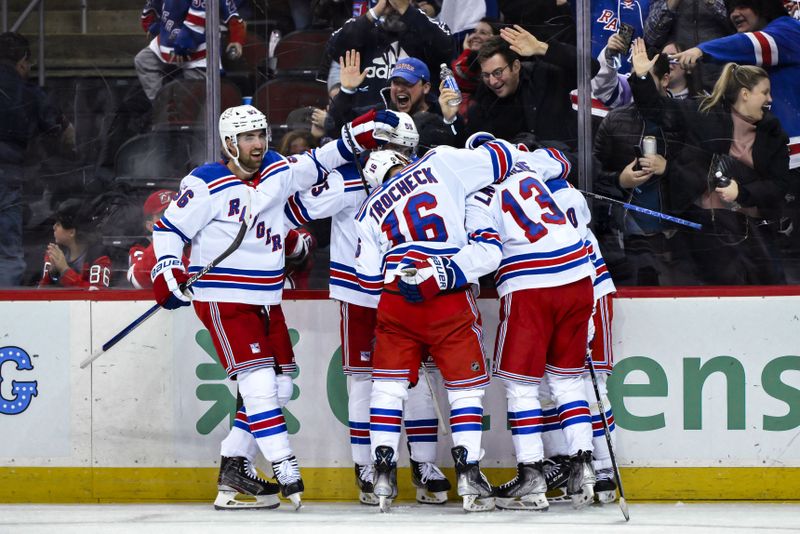 Nov 18, 2023; Newark, New Jersey, USA; New York Rangers left wing Artemi Panarin (10) celebrates with teammates after scoring a goal against the New Jersey Devils during the third period at Prudential Center. Mandatory Credit: John Jones-USA TODAY Sports