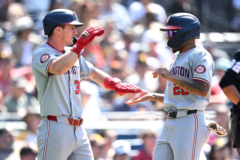 Jun 26, 2024; San Diego, California, USA; Washington Nationals shortstop Nasim Nunez (26) and center fielder Jacob Young (30) celebrate after scoring runs against the San Diego Padres during the ninth inning at Petco Park. Mandatory Credit: Orlando Ramirez-USA TODAY Sports