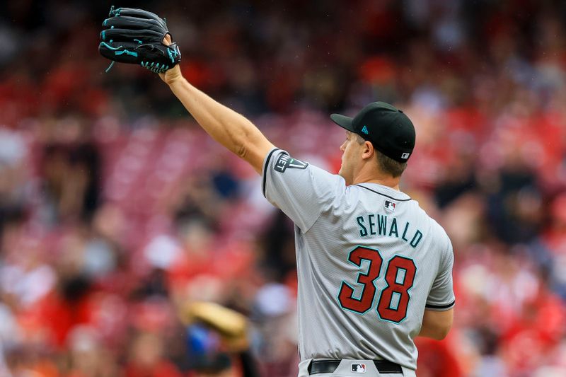 May 9, 2024; Cincinnati, Ohio, USA; Arizona Diamondbacks relief pitcher Paul Sewald (38) reacts after the victory over the Cincinnati Reds at Great American Ball Park. Mandatory Credit: Katie Stratman-USA TODAY Sports