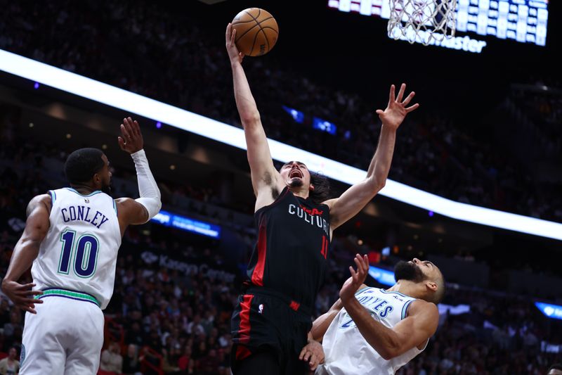 MIAMI, FLORIDA - DECEMBER 18: Jaime Jaquez Jr. #11 of the Miami Heat drives to the basket during the fourth quarter of the game against the Minnesota Timberwolves at Kaseya Center on December 18, 2023 in Miami, Florida. NOTE TO USER: User expressly acknowledges and agrees that, by downloading and or using this photograph, User is consenting to the terms and conditions of the Getty Images License Agreement. (Photo by Megan Briggs/Getty Images)