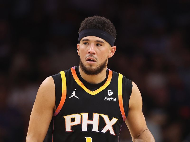 PHOENIX, ARIZONA - NOVEMBER 15: Devin Booker #1 of the Phoenix Suns handles the ball during the second half of the NBA game against the Minnesota Timberwolves at Footprint Center on November 15, 2023 in Phoenix, Arizona. The Suns defeated the Timberwolves 133-115. NOTE TO USER: User expressly acknowledges and agrees that, by downloading and or using this photograph, User is consenting to the terms and conditions of the Getty Images License Agreement.  (Photo by Christian Petersen/Getty Images)