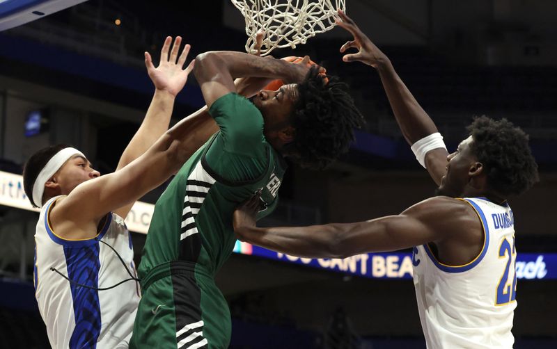 Dec 17, 2025; Pittsburgh, Pennsylvania, USA;  Binghamton Bearcats forward Zyier Beverly (middle) grabs a rebound between Pittsburgh Panthers forward Roman Siulepa (left) and guard Barry Dunning Jr. (22) during the first half at the Petersen Events Center. Mandatory Credit: Charles LeClaire-Imagn Images