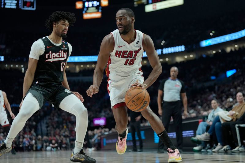 PORTLAND, OREGON - JANUARY 11: Alec Burks #18 of the Miami Heat dribbles the ball against Shaedon Sharpe #17 of the Portland Trail Blazers during the first half at Moda Center on January 11, 2025 in Portland, Oregon. NOTE TO USER: User expressly acknowledges and agrees that, by downloading and or using this photograph, User is consenting to the terms and conditions of the Getty Images License Agreement. (Photo by Soobum Im/Getty Images)