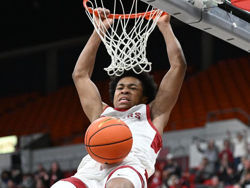 Jan 13, 2024; Pullman, Washington, USA; Washington State Cougars forward Jaylen Wells (0) dunks the ball against the Arizona Wildcats in the first half at Friel Court at Beasley Coliseum. Mandatory Credit: James Snook-USA TODAY Sports