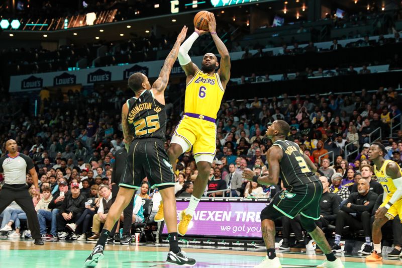 CHARLOTTE, NC - JANUARY 2: LeBron James #6 of the Los Angeles Lakers shoots the ball against the Charlotte Hornets on January 2, 2023 at Spectrum Center in Charlotte, North Carolina. NOTE TO USER: User expressly acknowledges and agrees that, by downloading and or using this photograph, User is consenting to the terms and conditions of the Getty Images License Agreement. Mandatory Copyright Notice: Copyright 2023 NBAE (Photo by Brock Williams-Smith/NBAE via Getty Images)