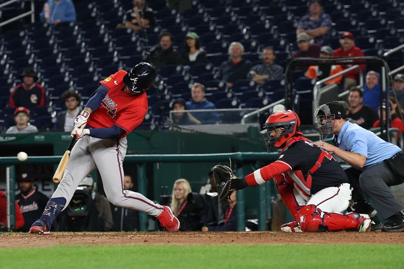 Sep 16, 2025; Washington, District of Columbia, USA; Atlanta Braves catcher Drake Baldwin (30) hits a go ahead RBI double against the Washington Nationals during the tenth inning at Nationals Park. Mandatory Credit: Geoff Burke-Imagn Images