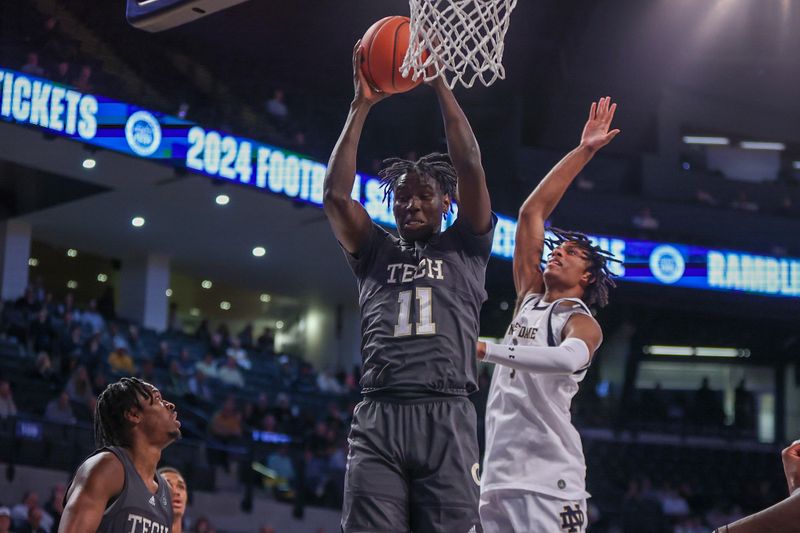 Jan 9, 2024; Atlanta, Georgia, USA; Georgia Tech Yellow Jackets forward Baye Ndongo (11) grabs a rebound against the Notre Dame Fighting Irish in the first half at McCamish Pavilion. Mandatory Credit: Brett Davis-USA TODAY Sports
