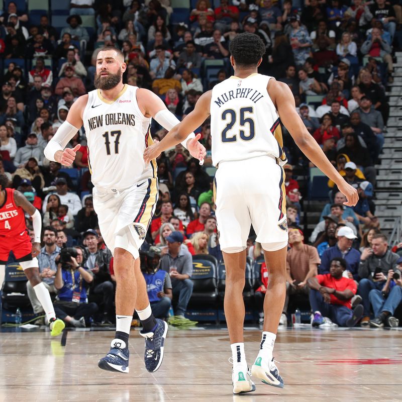 NEW ORLEANS, LA - FEBRUARY 22: Jonas Valanciunas #17 and Trey Murphy III #25 of the New Orleans Pelicans high five during the game against the Houston Rockets on February 22, 2024 at the Smoothie King Center in New Orleans, Louisiana. NOTE TO USER: User expressly acknowledges and agrees that, by downloading and or using this Photograph, user is consenting to the terms and conditions of the Getty Images License Agreement. Mandatory Copyright Notice: Copyright 2024 NBAE (Photo by Layne Murdoch Jr./NBAE via Getty Images)