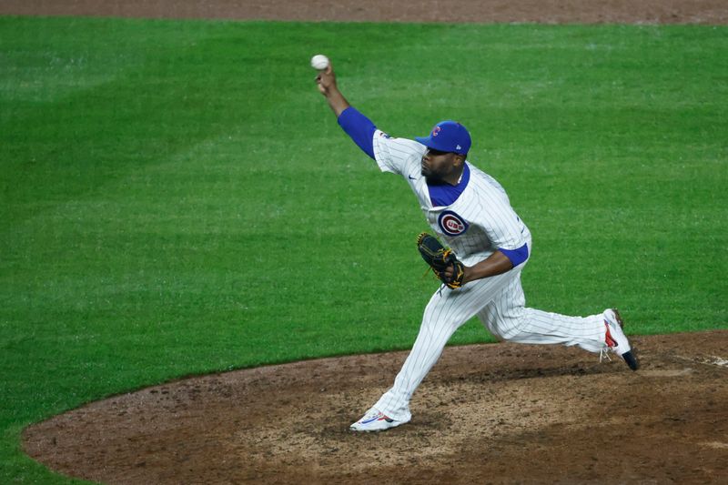 Jun 2, 2024; Chicago, Illinois, USA; Chicago Cubs relief pitcher Héctor Neris (51) delivers a pitch against the Cincinnati Reds during the ninth inning at Wrigley Field. Mandatory Credit: Kamil Krzaczynski-USA TODAY Sports