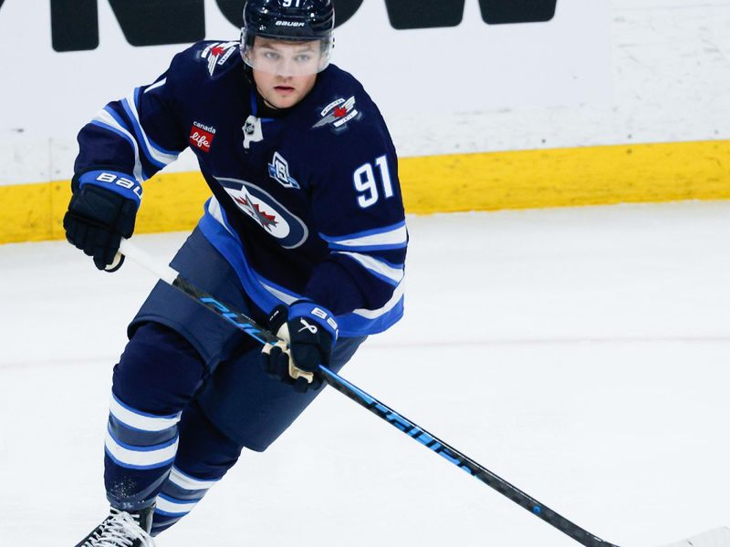 Mar 3, 2026; Winnipeg, Manitoba, CAN;  Winnipeg Jets forward Cole Perfetti (91) skates against the Chicago Blackhawks during the third period at Canada Life Centre. Mandatory Credit: Terrence Lee-Imagn Images
