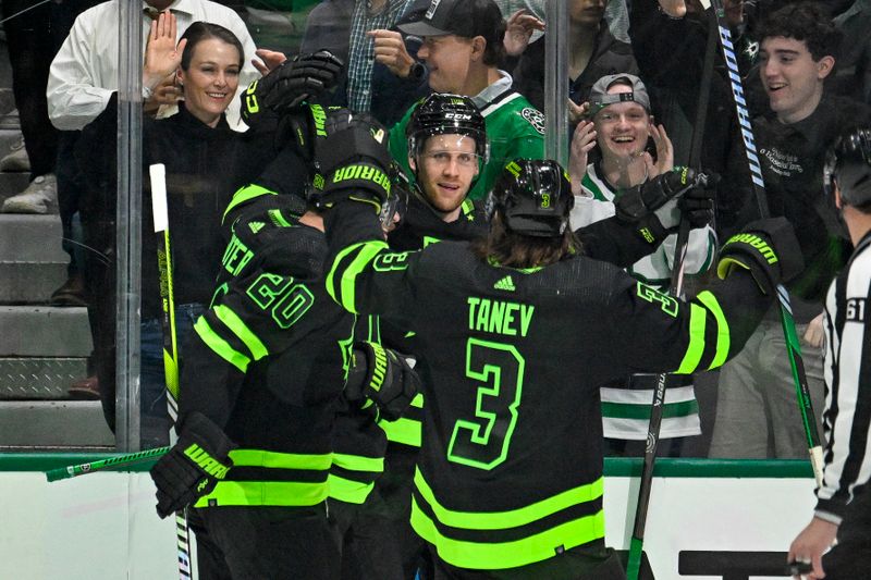 Apr 3, 2024; Dallas, Texas, USA; Dallas Stars defenseman Ryan Suter (20) and center Radek Faksa (12) and defenseman Chris Tanev (3) celebrates a goal scored by Faksa against the Edmonton Oilers during the first period at the American Airlines Center. Mandatory Credit: Jerome Miron-USA TODAY Sports