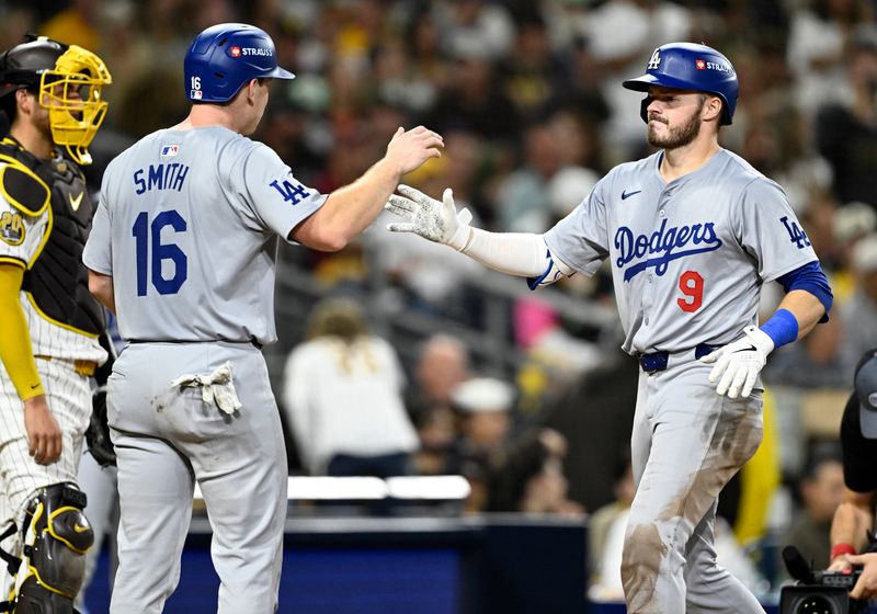 Oct 9, 2024; San Diego, California, USA; Los Angeles Dodgers second baseman Gavin Lux (9) celebrates with catcher Will Smith (16) after hitting a two-run home run in the seventh inning against the San Diego Padres during game four of the NLDS for the 2024 MLB Playoffs at Petco Park.  Mandatory Credit: Denis Poroy-Imagn Images