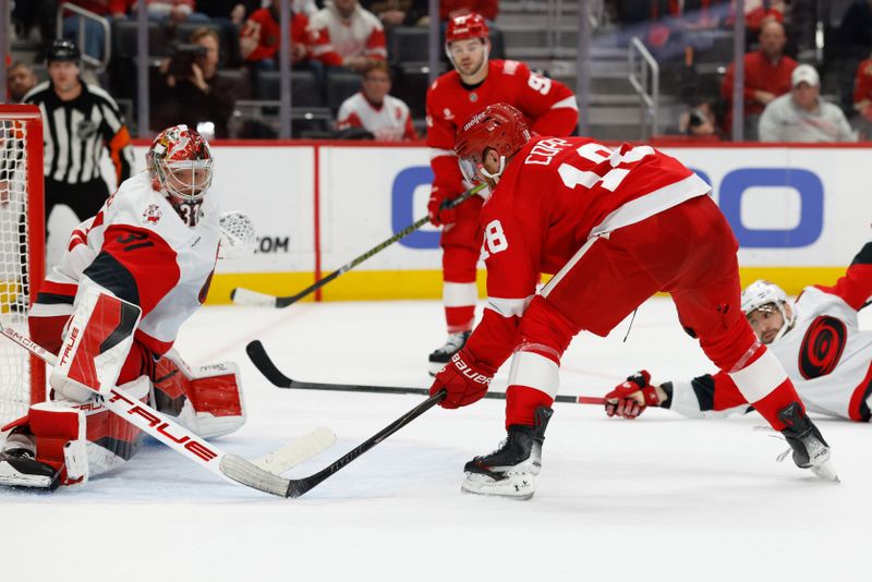 Jan 12, 2026; Detroit, Michigan, USA;  Detroit Red Wings center Andrew Copp (18) scores in overtime against the Carolina Hurricanes at Little Caesars Arena. Mandatory Credit: Rick Osentoski-Imagn Images
