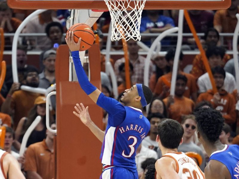 Mar 4, 2023; Austin, Texas, USA; Kansas Jayhawks guard Dajuan Harris Jr. (3) shoots from under the basket during the first half against the Texas Longhorns at Moody Center. Mandatory Credit: Scott Wachter-USA TODAY Sports