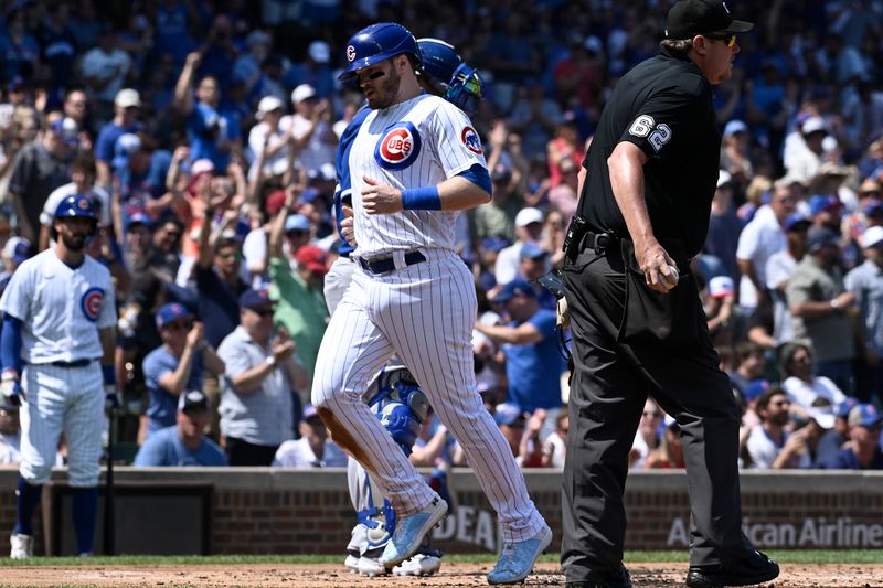 Aug 20, 2023; Chicago, Illinois, USA; Chicago Cubs left fielder Ian Happ (8) scores against the Kansas City Royals during the first inning at Wrigley Field. Mandatory Credit: Matt Marton-USA TODAY Sports