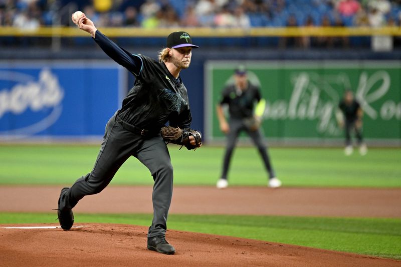 Aug 31, 2024; St. Petersburg, Florida, USA; Tampa Bay Rays starting pitcher Shane Baz (11) throws against the San Diego Padres in the first inning at Tropicana Field. Mandatory Credit: Jonathan Dyer-USA TODAY Sports