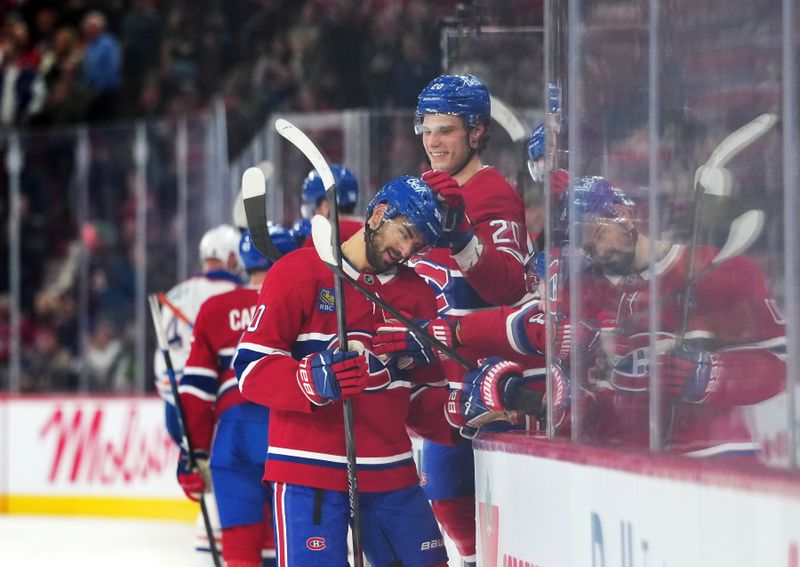 Dec 14, 2025; Montreal, Quebec, CAN; Montreal Canadiens forward Joe Veleno (90) celebrates with teammates after scoring a goal against the Edmonton Oilers during the second period at the Bell Centre. Mandatory Credit: Eric Bolte-Imagn Images