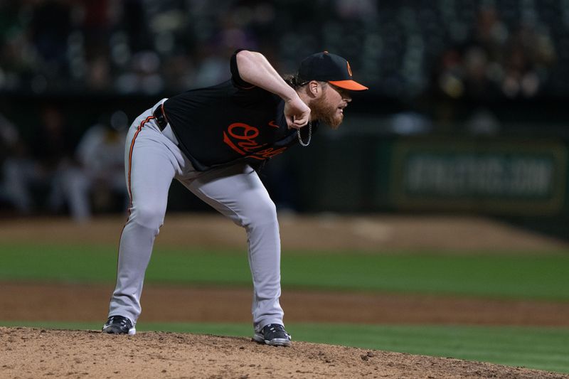 Jul 5, 2024; Oakland, California, USA;  Baltimore Orioles pitcher Craig Kimbrel (46) pitches during the ninth inning against the Oakland Athletics at Oakland-Alameda County Coliseum. Mandatory Credit: Stan Szeto-USA TODAY Sports