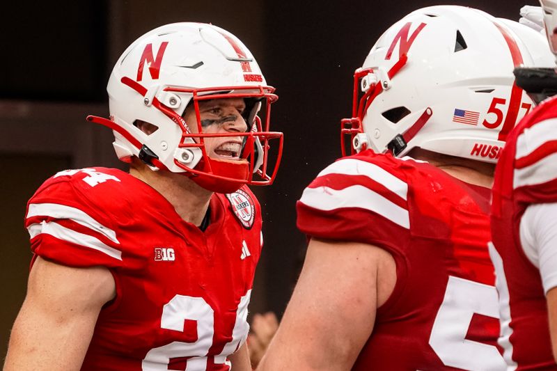 Sep 23, 2023; Lincoln, Nebraska, USA; Nebraska Cornhuskers tight end Thomas Fidone II (24) celebrates with offensive lineman Ethan Piper (57) after scoring against the Louisiana Tech Bulldogs during the fourth quarter at Memorial Stadium. Mandatory Credit: Dylan Widger-USA TODAY Sports