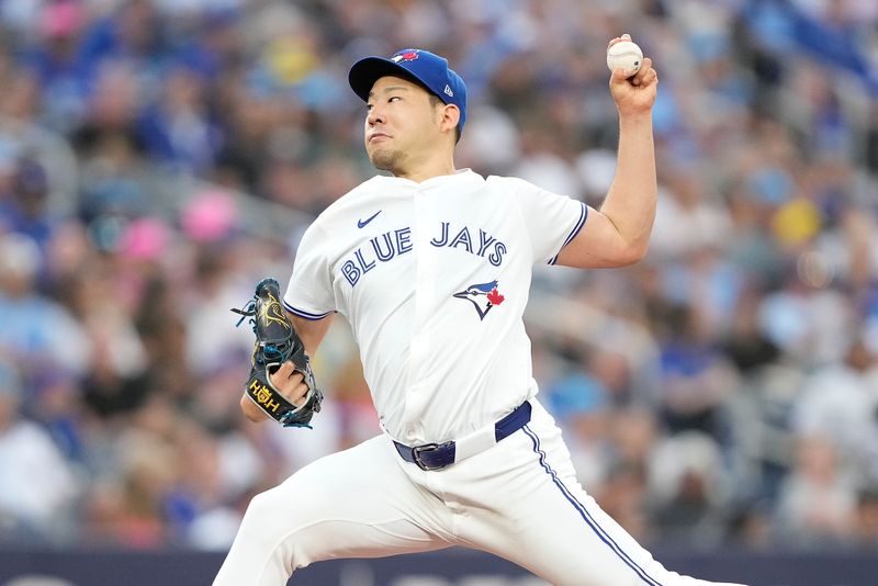 Jul 26, 2024; Toronto, Ontario, CAN; Toronto Blue Jays starting pitcher Yusei Kikuchi (16) pitches to the Texas Rangers during the third inning at Rogers Centre. Mandatory Credit: John E. Sokolowski-USA TODAY Sports