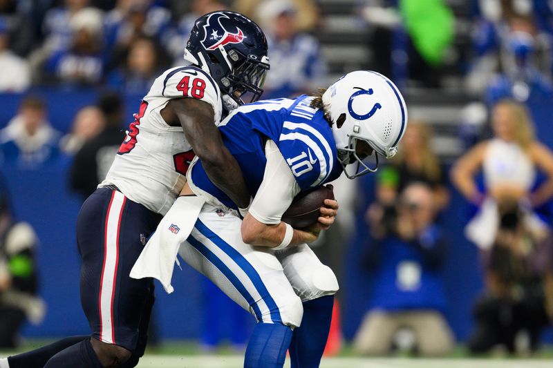 Houston Texans linebacker Christian Harris (48) sacks Indianapolis Colts quarterback Gardner Minshew (10) during an NFL football game, Saturday, Jan. 6, 2024, in Indianapolis. (AP Photo/Zach Bolinger)