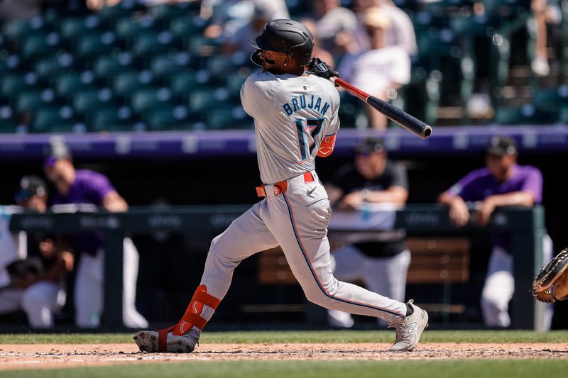 Aug 29, 2024; Denver, Colorado, USA; Miami Marlins shortstop Vidal Brujan (17) hits a single in the fourth inning against the Colorado Rockies at Coors Field. Mandatory Credit: Isaiah J. Downing-USA TODAY Sports