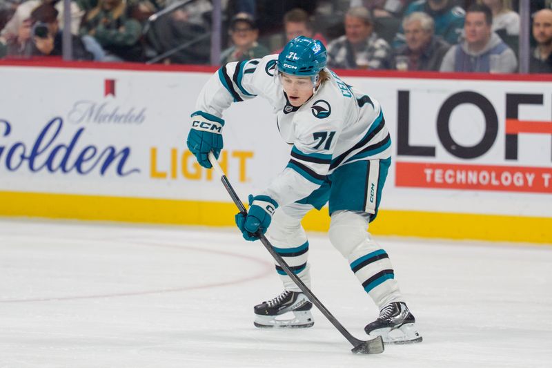 Nov 11, 2025; Saint Paul, Minnesota, USA; San Jose Sharks center Macklin Celebrini (71) shoots the puck against the Minnesota Wild in the first period at Grand Casino Arena. Mandatory Credit: Matt Blewett-Imagn Images