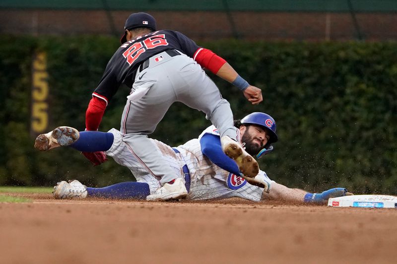 Sep 22, 2024; Chicago, Illinois, USA; Chicago Cubs shortstop Dansby Swanson (7) is picked-off of second base as Washington Nationals shortstop Nasim Nuñez (26) takes the throw during the seventh inning at Wrigley Field. Mandatory Credit: David Banks-Imagn Images