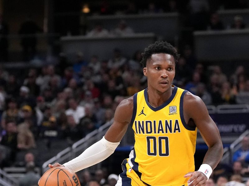 INDIANAPOLIS, INDIANA - FEBRUARY 23: Bennedict Mathurin #00 of the Indiana Pacers dribbles the ball in the first quarter against the Los Angeles Clippers at Gainbridge Fieldhouse on February 23, 2025 in Indianapolis, Indiana. NOTE TO USER: User expressly acknowledges and agrees that, by downloading and or using this photograph, User is consenting to the terms and conditions of the Getty Images License Agreement. (Photo by Dylan Buell/Getty Images)