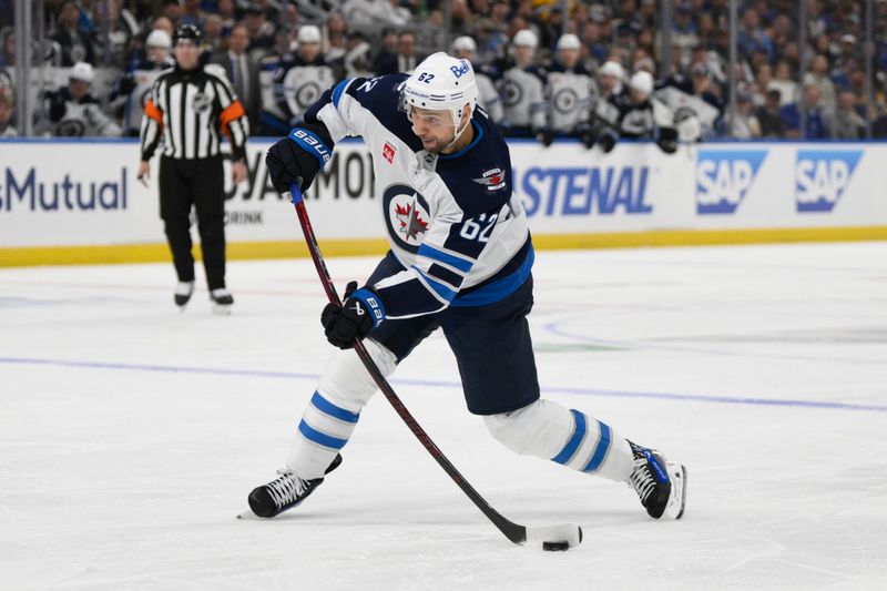 Apr 27, 2025; St. Louis, Missouri, USA; Winnipeg Jets right wing Nino Niederreiter (62) shoots against the St. Louis Blues during the first period in game four of the first round of the 2025 Stanley Cup Playoffs at Enterprise Center. Mandatory Credit: Jeff Le-Imagn Images