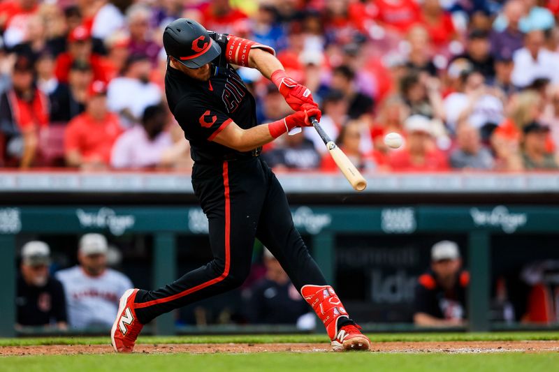 May 16, 2025; Cincinnati, Ohio, USA; Cincinnati Reds catcher Tyler Stephenson (37) hits a single in the sixth inning against the Cleveland Guardians at Great American Ball Park. Mandatory Credit: Katie Stratman-Imagn Images