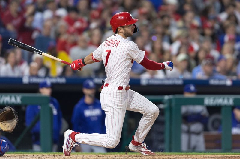 Jun 9, 2023; Philadelphia, Pennsylvania, USA; Philadelphia Phillies shortstop Trea Turner (7) hits an RBI single during the fifth inning against the Los Angeles Dodgers at Citizens Bank Park. Mandatory Credit: Bill Streicher-USA TODAY Sports