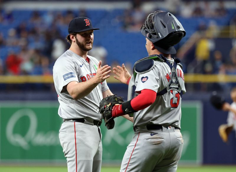 May 20, 2024; St. Petersburg, Florida, USA; Boston Red Sox catcher Reese McGuire (3) and pitcher Justin Slaten (63) high five after they beat the Tampa Bay Rays  at Tropicana Field. Mandatory Credit: Kim Klement Neitzel-USA TODAY Sports