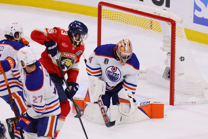 Jun 24, 2024; Sunrise, Florida, USA; Florida Panthers forward Carter Verhaeghe (23) watches as forward Sam Reinhart (13) (not pictured) scores against Edmonton Oilers goaltender Skinner Stuart (74) during the second period in game seven of the 2024 Stanley Cup Final at Amerant Bank Arena. Mandatory Credit: Sam Navarro-USA TODAY Sports