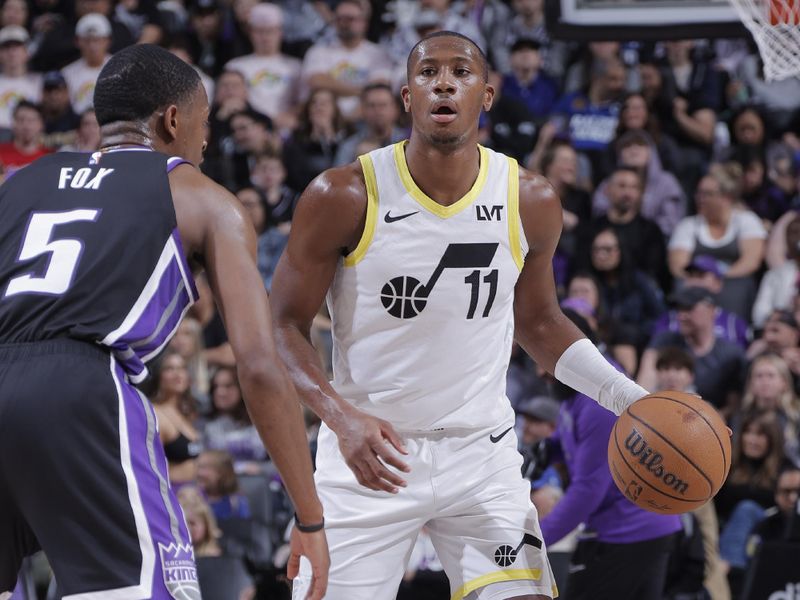 SACRAMENTO, CA - MARCH 31: Kris Dunn #11 of the Utah Jazz dribbles the ball during the game against the Sacramento Kings on March 31, 2024 at Golden 1 Center in Sacramento, California. NOTE TO USER: User expressly acknowledges and agrees that, by downloading and or using this Photograph, user is consenting to the terms and conditions of the Getty Images License Agreement. Mandatory Copyright Notice: Copyright 2024 NBAE (Photo by Rocky Widner/NBAE via Getty Images)