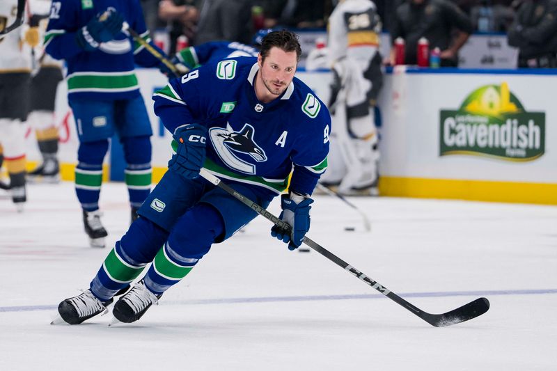 Nov 30, 2023; Vancouver, British Columbia, CAN; Vancouver Canucks forward J.T. Miller (9) skates during warm up prior to a game against the Vegas Golden Knights at Rogers Arena. Mandatory Credit: Bob Frid-USA TODAY Sports