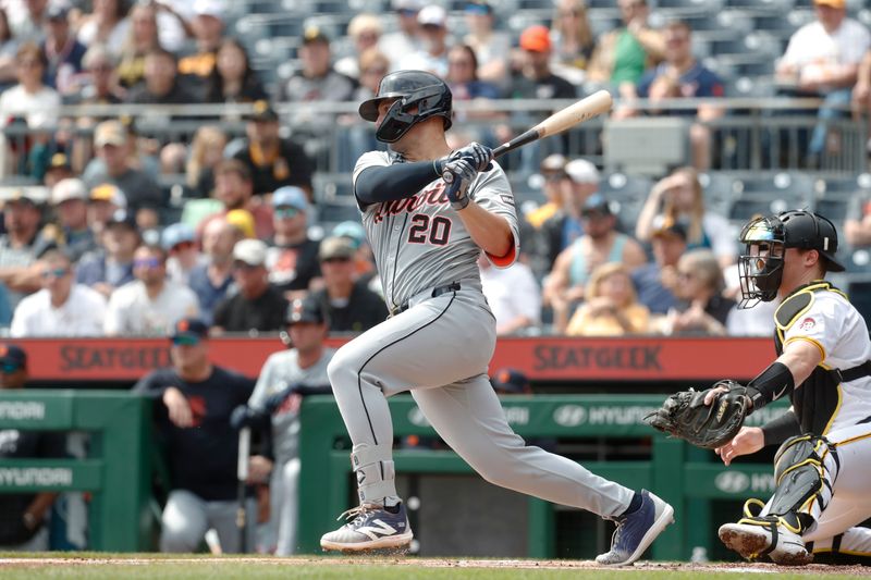 Apr 9, 2024; Pittsburgh, Pennsylvania, USA;  Detroit Tigers first baseman Spencer Torkelson (20) hits an RBI single against the Pittsburgh Pirates during the first inning at PNC Park. Mandatory Credit: Charles LeClaire-USA TODAY Sports