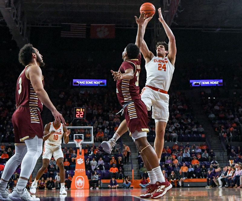 Jan 13, 2024; Clemson, South Carolina, USA; Clemson Tigers forward PJ Hall (24) shoots the ball against Boston College Eagles forward Elijah Strong (31) during the first half at Littlejohn Coliseum. Mandatory Credit: Ken Ruinard-USA TODAY Sports