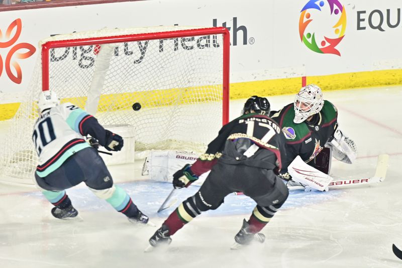 Nov 7, 2023; Tempe, Arizona, USA; Seattle Kraken right wing Eeli Tolvanen (20) scores on Arizona Coyotes goaltender Connor Ingram (39) in the first period at Mullett Arena. Mandatory Credit: Matt Kartozian-USA TODAY Sports