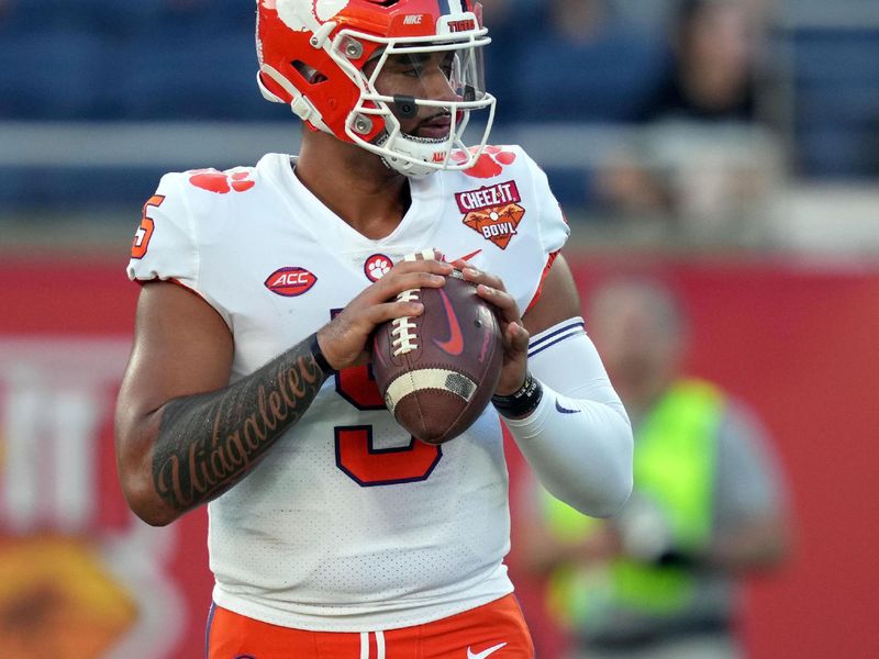 Dec 29, 2021; Orlando, Florida, USA; Clemson Tigers quarterback D.J. Uiagalelei (5) runs through drills during pregame warmups before the 2021 Cheez-It Bowl against the Iowa State Cyclones at Camping World Stadium. Mandatory Credit: Jasen Vinlove-USA TODAY Sports