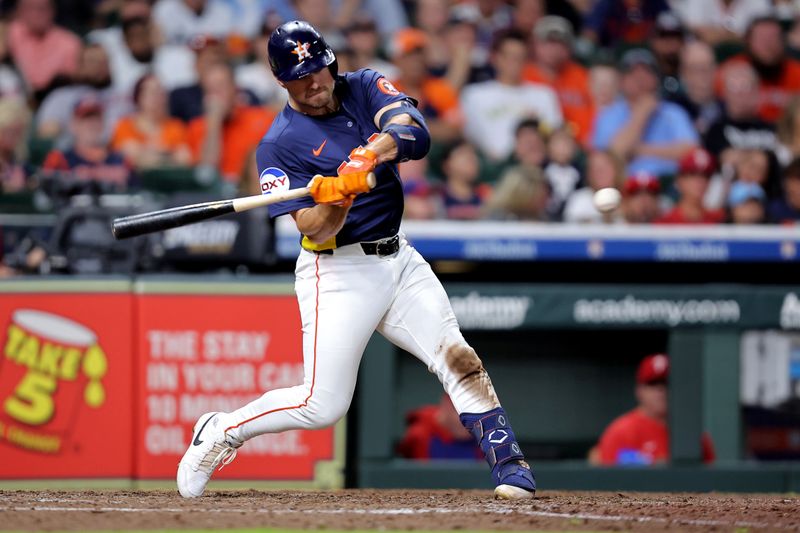 Jun 24, 2025; Houston, Texas, USA; Houston Astros left fielder Cooper Hummel (16) hits a home run to right field against the Philadelphia Phillies during the eighth inning at Daikin Park. Mandatory Credit: Erik Williams-Imagn Images