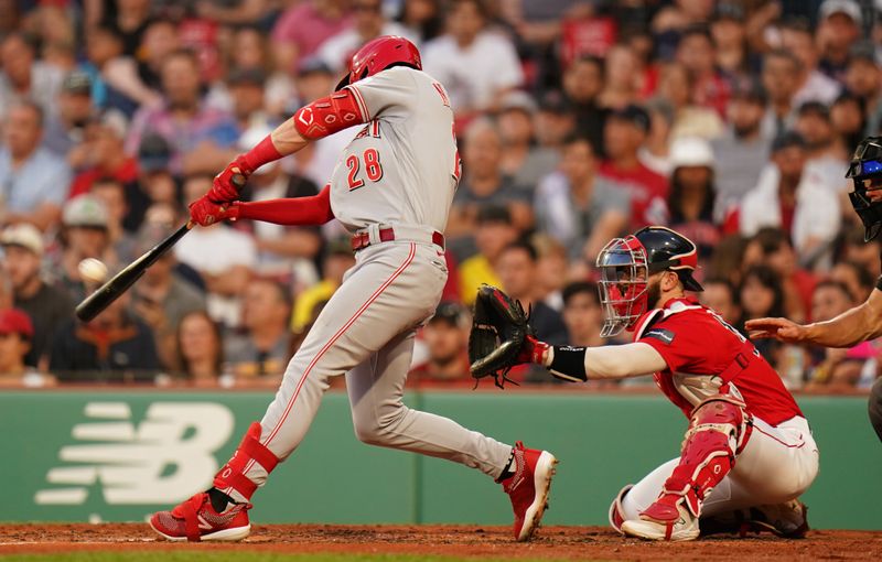 Jun 1, 2023; Boston, Massachusetts, USA; Cincinnati Reds shortstop Kevin Newman (28) hits a double and drives in a run against the Boston Red Sox in the third inning at Fenway Park. Mandatory Credit: David Butler II-USA TODAY Sports