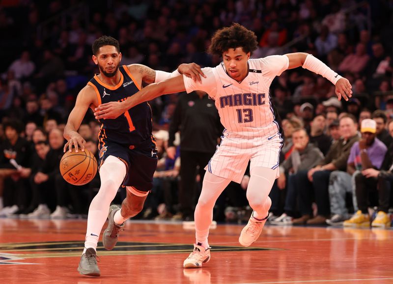 NEW YORK, NEW YORK - DECEMBER 03: Cameron Payne #1 of the New York Knicks drives against Jett Howard #13 of the Orlando Magic during their game at Madison Square Garden on December 03, 2024 in New York City.   User expressly acknowledges and agrees that, by downloading and or using this photograph, User is consenting to the terms and conditions of the Getty Images License Agreement.  (Photo by Al Bello/Getty Images)