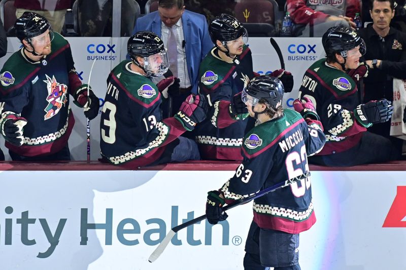 Mar 27, 2023; Tempe, Arizona, USA;  Arizona Coyotes left wing Matias Maccelli (63) celebrates with teammates after scoring a goal in the first period against the Edmonton Oilers at Mullett Arena. Mandatory Credit: Matt Kartozian-USA TODAY Sports